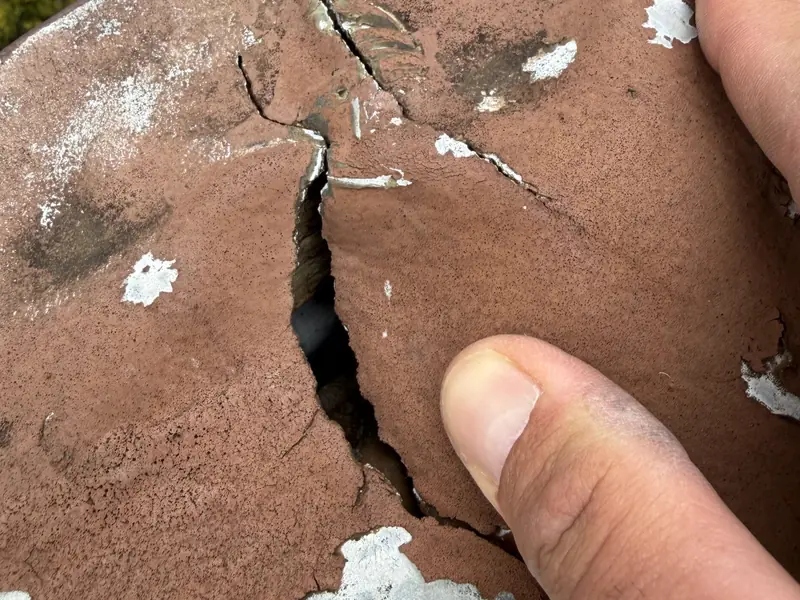 Close-up of a cracked roof tile found on an inspection
