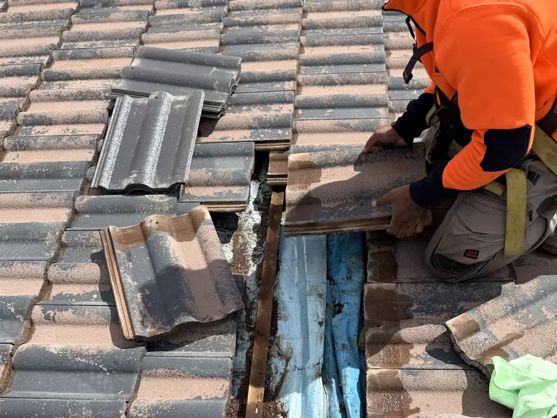 Tiles lifted and stacked while our roofer repairs a section of the roof