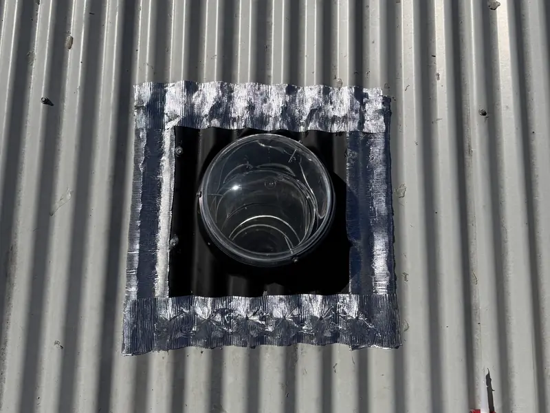Skylight on a metal roof sealed around the edge