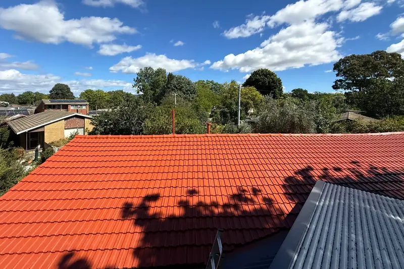 Restored tiled roof after re-coating